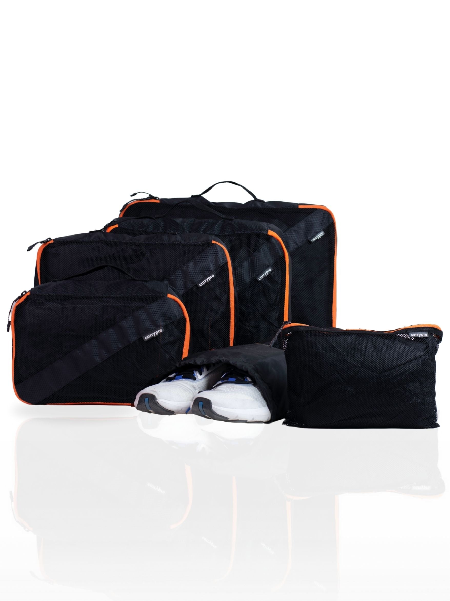 Multicolour Black travel packing cubes set with yellow and orange zipper accents, arranged together showing various sizes #color_Black